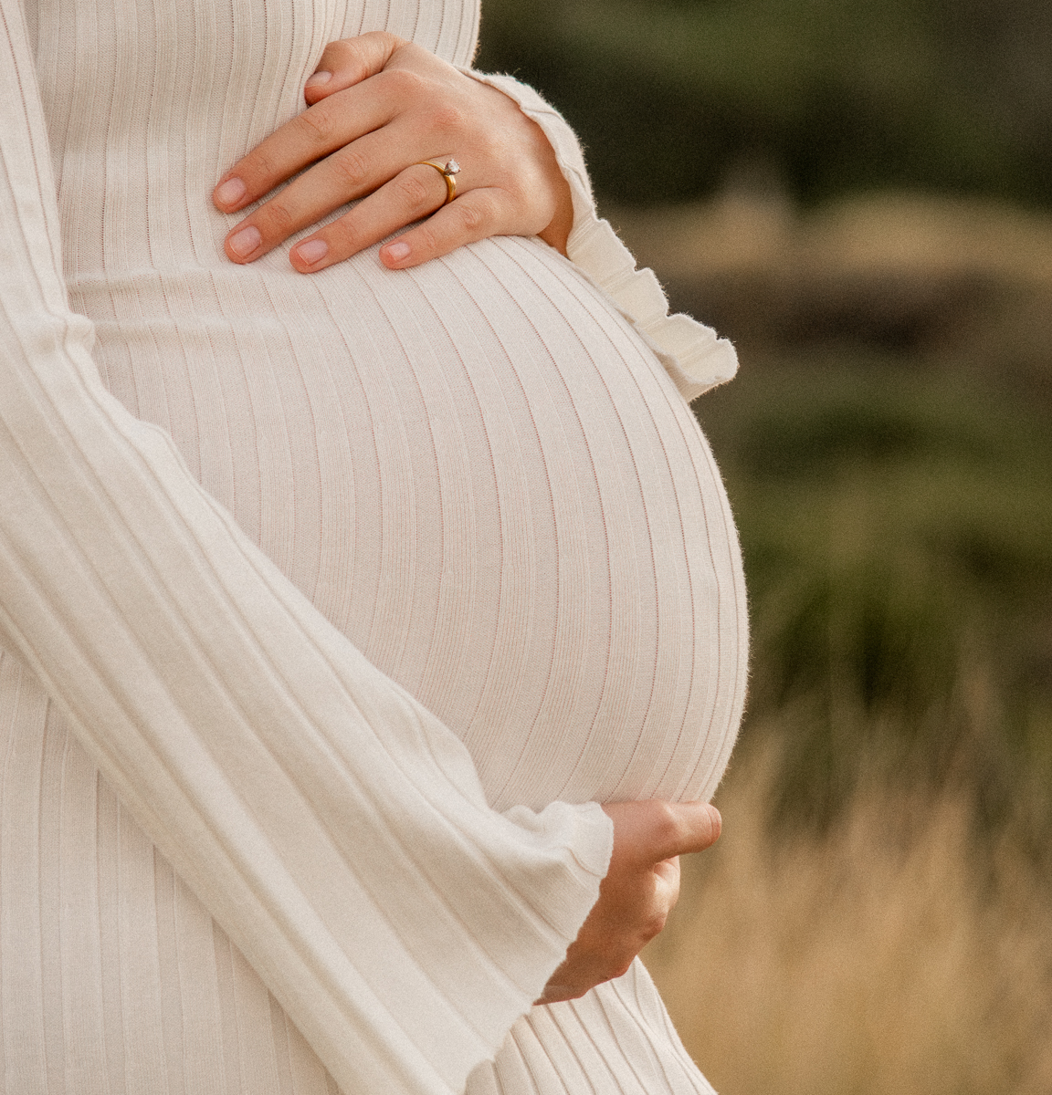 Kiama maternity session close up photograph of mother holding her stomach